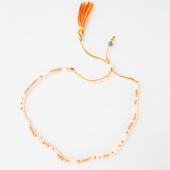 goldmarie Freundschaftsarmband LILLY - mit Perlen - creme-weiß-orange 