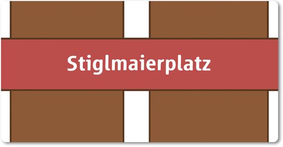 U-Bahnhof Stiglmaierplatz Kühlschrankmagnet - weiße Schrift auf rotem Streifen, vor weiß-braunem gestreiftem Hintergrund