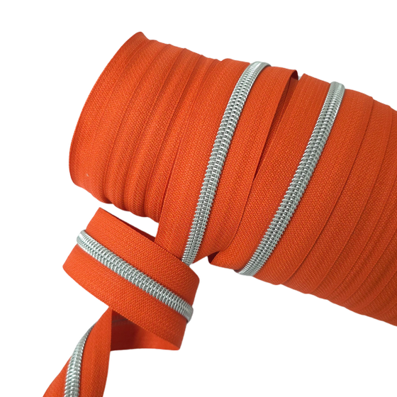 Endlos-Reißverschluss metallisiert silber - pumpkin orange