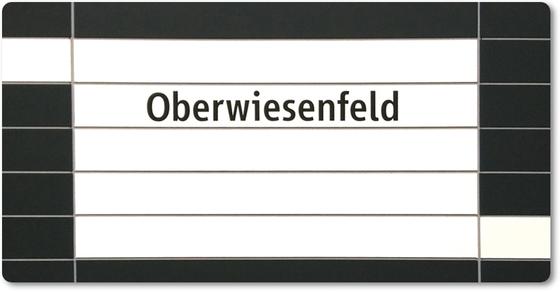 U-Bahnhof Oberwiesenfeld Kühlschrankmagnet - schwarze Schrift auf weißem Untergrund, mit schwarzer Umrandung und grauen Querfugen