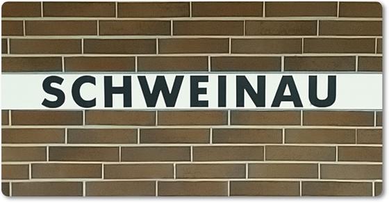 U-Bahn-Magnet Nuernberg Schweinau der Linie U2 in der originalgetreuen Stations-Gestaltung mit braunen Kacheln und weissem Balken  mit schwarzer Schrift