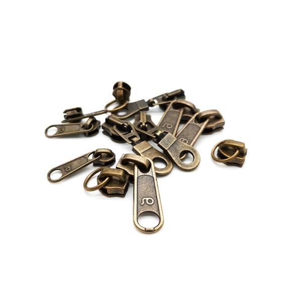 Bügelschieber / Zipper "Standard" für Endlos Reißverschluss schmal- altmessing