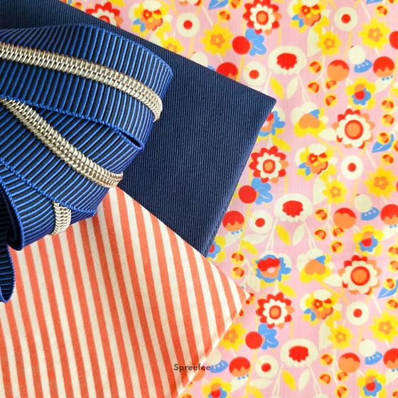 Baumwollstoff Marmalade Bloom aus der Kollektion Stannie & Lloyd von August Ellery für FreeSpirit Fabrics mit einem detailreichen floralen Muster in leuchtenden Farben. Ideal für Patchwork, Quilts, Taschen und kreative Nähprojekte.