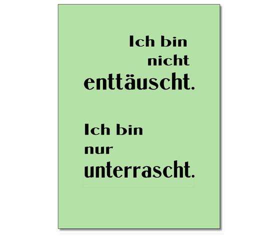 Spruchkarte mit dem Text "Ich bin nicht enttaeuscht. Ich bin nur unterrascht" - schwarze Schrift auf pastellfrabenem blassgruenen Hintergrund