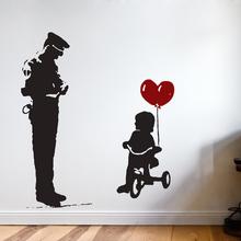 BANKSY Wandtattoo Wall Art COP & GIRL auf Dreierad mit Herz Luftballon 2C Wandtattoo Streetart von Urban ART Berlin